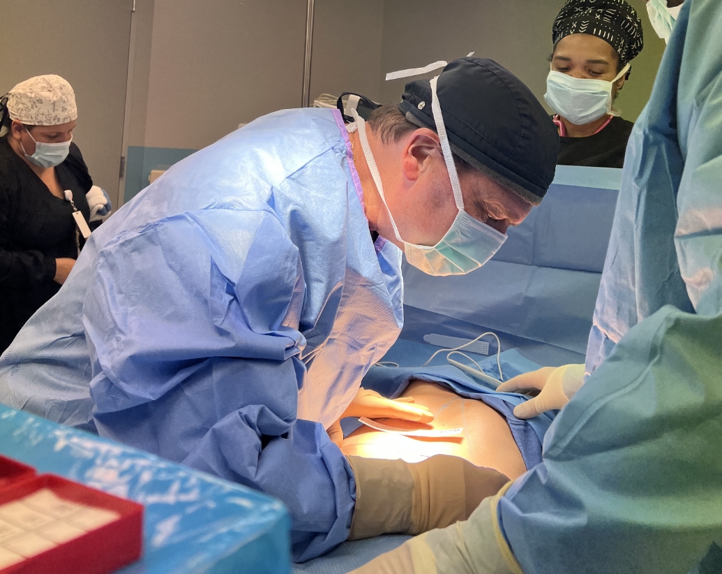 Dr. Newall operating on patient